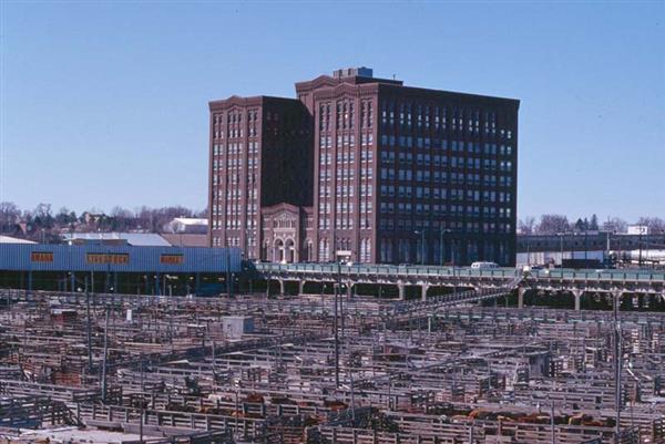 Livestock exchange building with stockyards out front